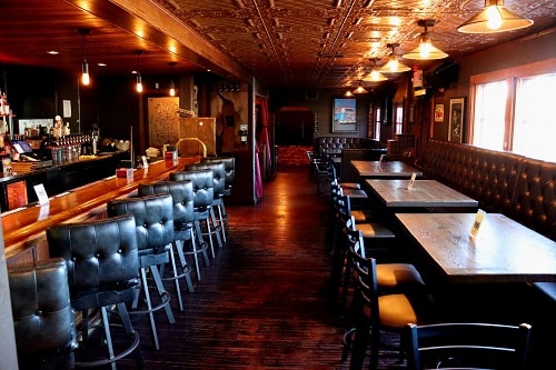 Main dining saloon and bar for private dining at The Cats